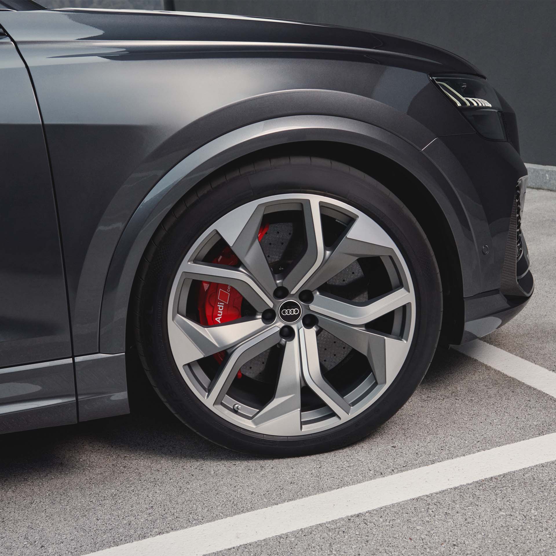 Audi RS Q8 rear view with female model